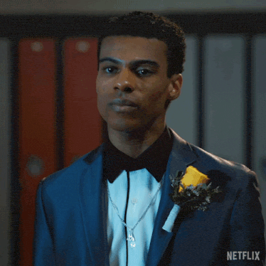 a man in a tuxedo says i 'm done with a netflix logo in the background