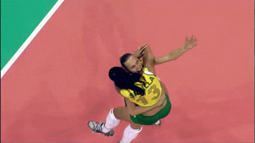 a woman wearing a yellow jersey with the number 15 on it