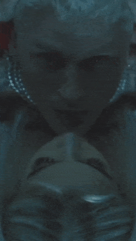 a close up of a woman with blue eyes