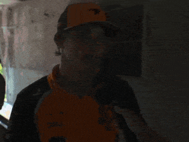 a man wearing a hat and a shirt that says dell