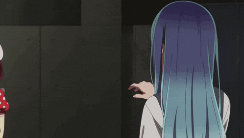 a girl with red hair is talking to another girl with blue hair