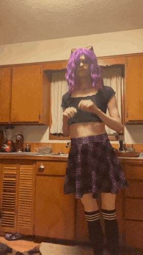 a woman in a purple wig and plaid skirt is standing in a kitchen