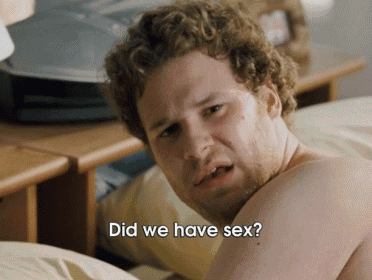 a man laying on a bed with the words " did we have sex " written on his arm