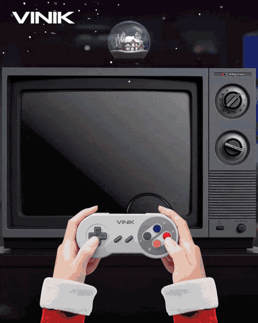 a person is holding a vink controller in front of a television