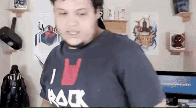 a man wearing a shirt that says i love rock