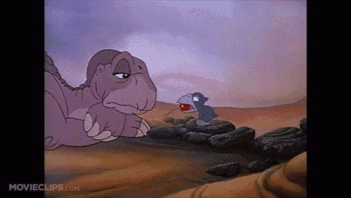 a cartoon of a dinosaur and a baby dinosaur with movieclips.com at the bottom of the screen