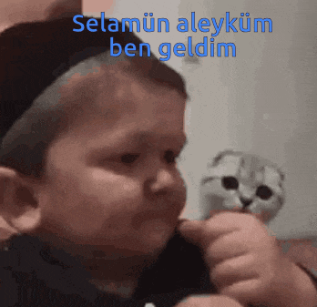 a baby holding a stuffed animal with the words selamun aleykum ben geldim written on it