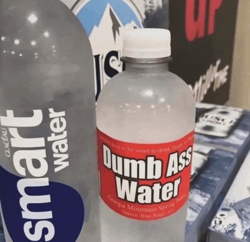 a bottle of dumb ass water sits on a table