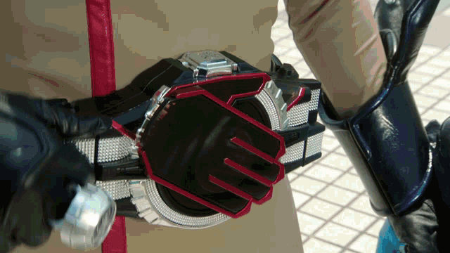 a close up of a person holding a belt that says yz