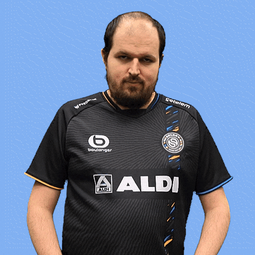 a man wearing a black shirt that says aldi on the front