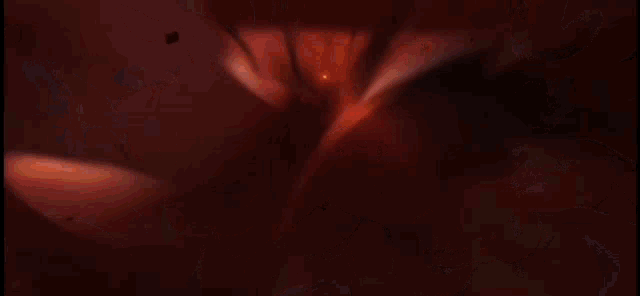a cartoon character is standing in a dark room with a sword in his hand .