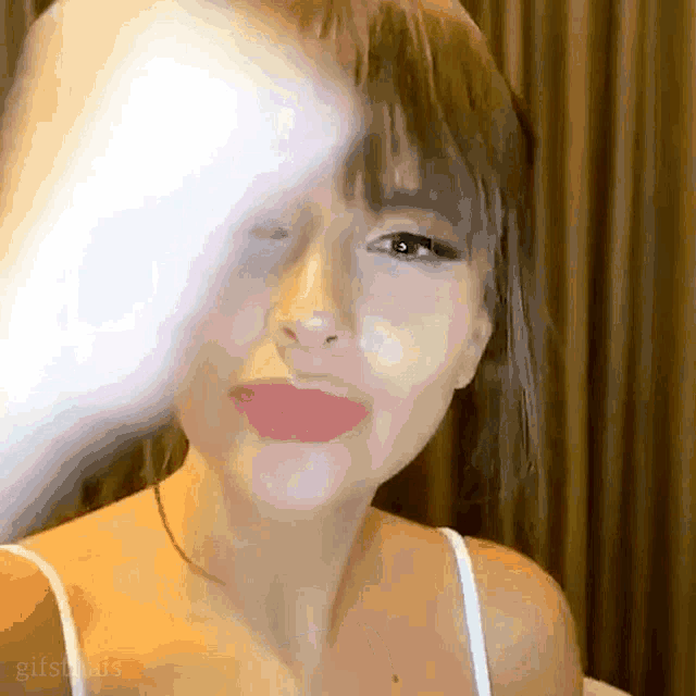 a close up of a woman 's face with the word gifs on the bottom right