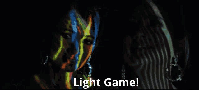 a woman 's face is projected on another woman 's face with the words light game written below it