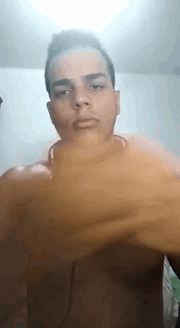 a man wearing headphones looks at the camera