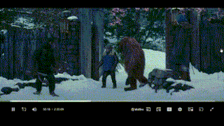 a screen shot of a movie shows a group of people walking in the snow ..