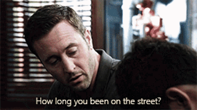 a man talking to another man with the words how long you been on the street