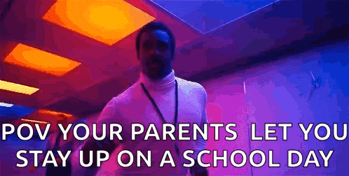 a man is walking down a hallway with the words `` rov your parents let you stay up on a school day ''