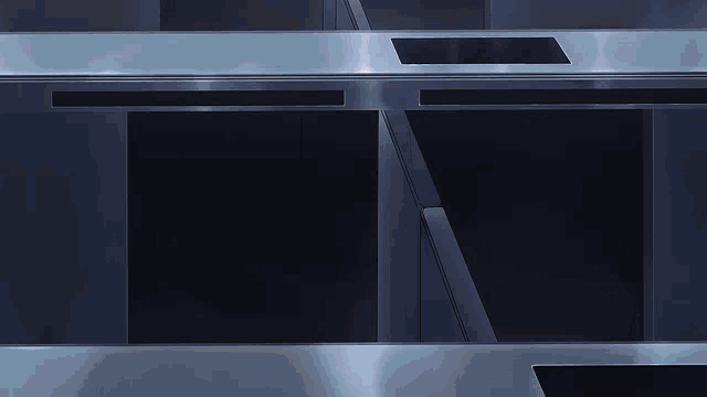 a row of stainless steel appliances with a black background