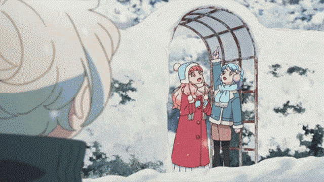 a couple of girls are standing in the snow looking at something