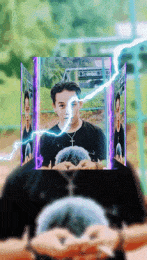 a man with a cross necklace is surrounded by purple lightning bolts