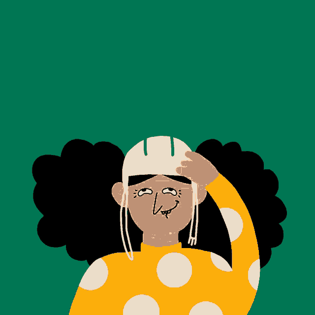 a woman in a yellow polka dot shirt is holding a mask over her head