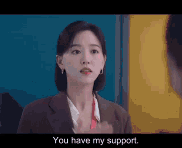 a woman in a suit says " you have my support " to another woman