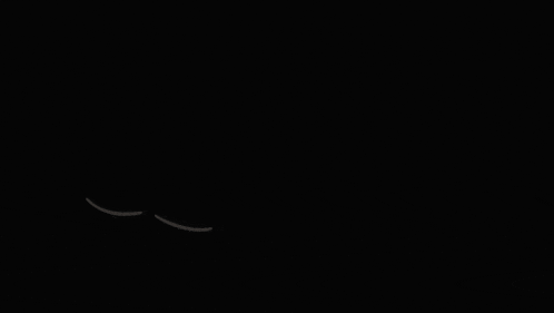four white circles with holes in them are floating in the dark