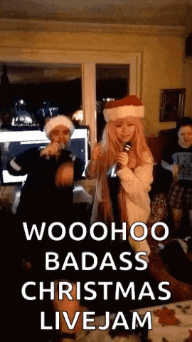 two people are singing into microphones at a christmas live jam
