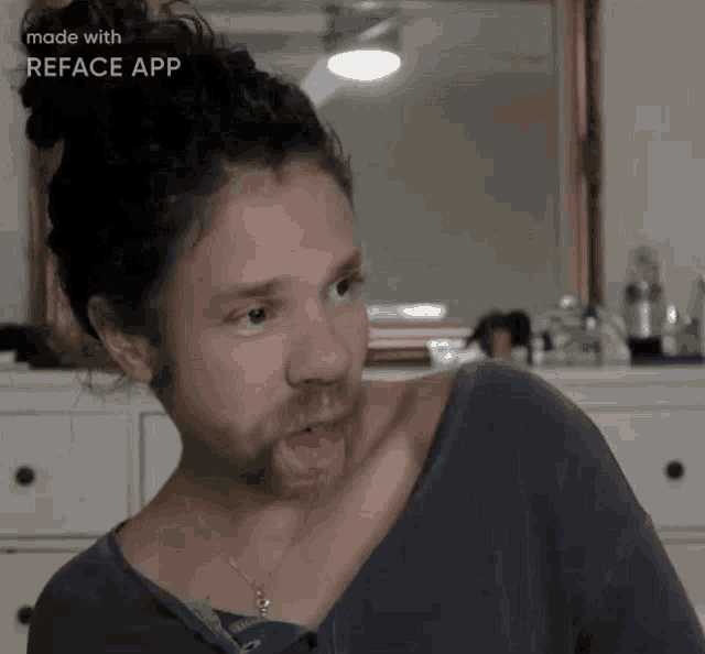 a woman with a beard is making a funny face in front of a mirror made with the reface app