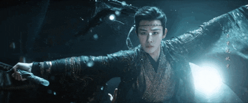 a man in a kimono is holding a sword in his right hand