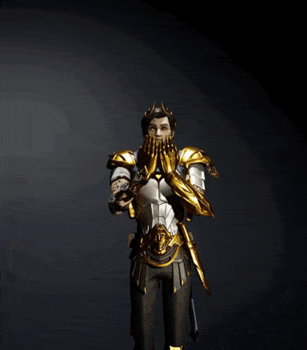 a man in a knight 's armor with his arm outstretched