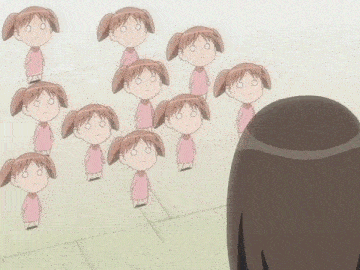 a girl stands in front of a bunch of cartoon characters