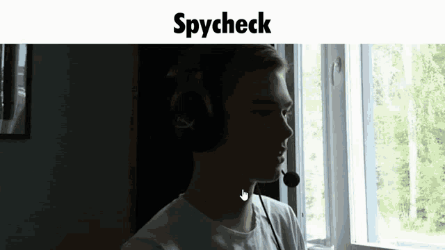 a man wearing headphones and a microphone with the word spycheck on the bottom