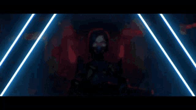 a woman wearing a gas mask is standing in front of a neon background .