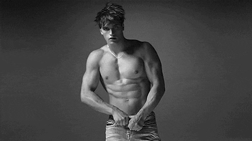 a man is wearing calvin klein underwear and jeans .