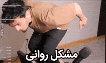 a man is sitting in a chair with a foreign language written on it