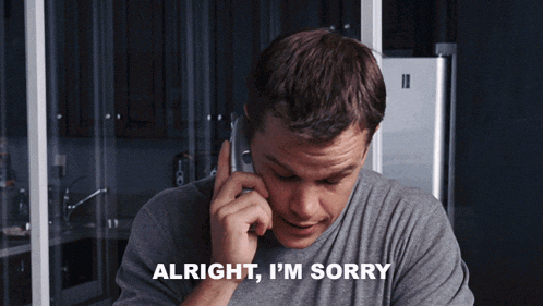 a man talking on a cell phone with the words " alright i 'm sorry " below him