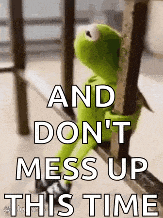 kermit the frog is sitting on a railing holding onto a railing .