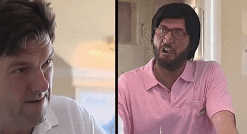 a man with glasses and a beard is wearing a pink polo shirt