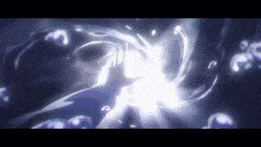 a person 's hand is reaching out towards a glowing object in the dark