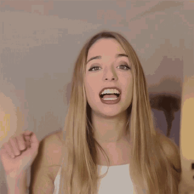 a woman says a lot easier in yellow letters on a white background