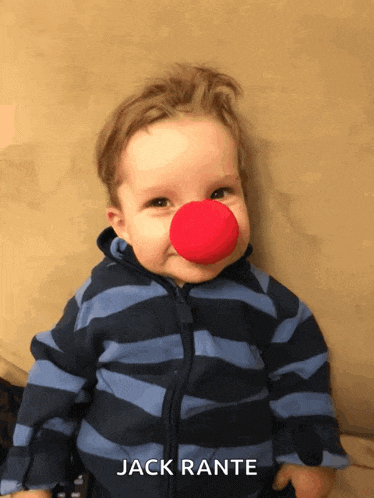 a baby wearing a red nose and the name jack rante