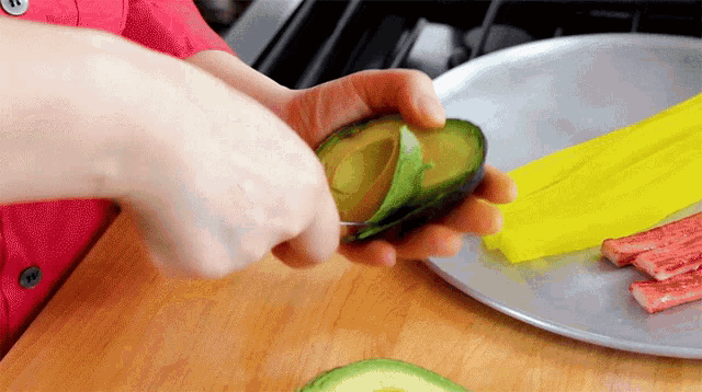 Scooping Avocado Maangchi GIF - Scooping Avocado Maangchi Peeling Avocado GIFs