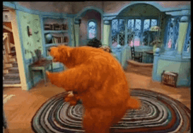 two bears are dancing in a room with a rug on the floor