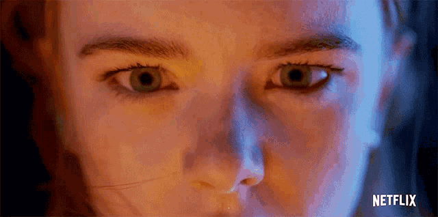 a close up of a woman 's face with the word netflix on the bottom right