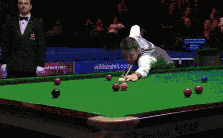 a man playing snooker with a williamhill.com banner in the background