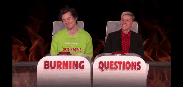 harry styles and ellen degeneres are sitting in front of a burning questions sign .