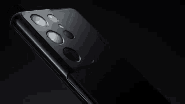 a close up of the back of a cell phone showing the camera lenses