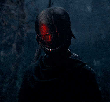 a person wearing a black helmet with a red light coming out of it
