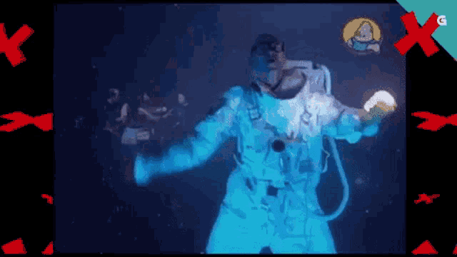 a man in a space suit is holding a flashlight